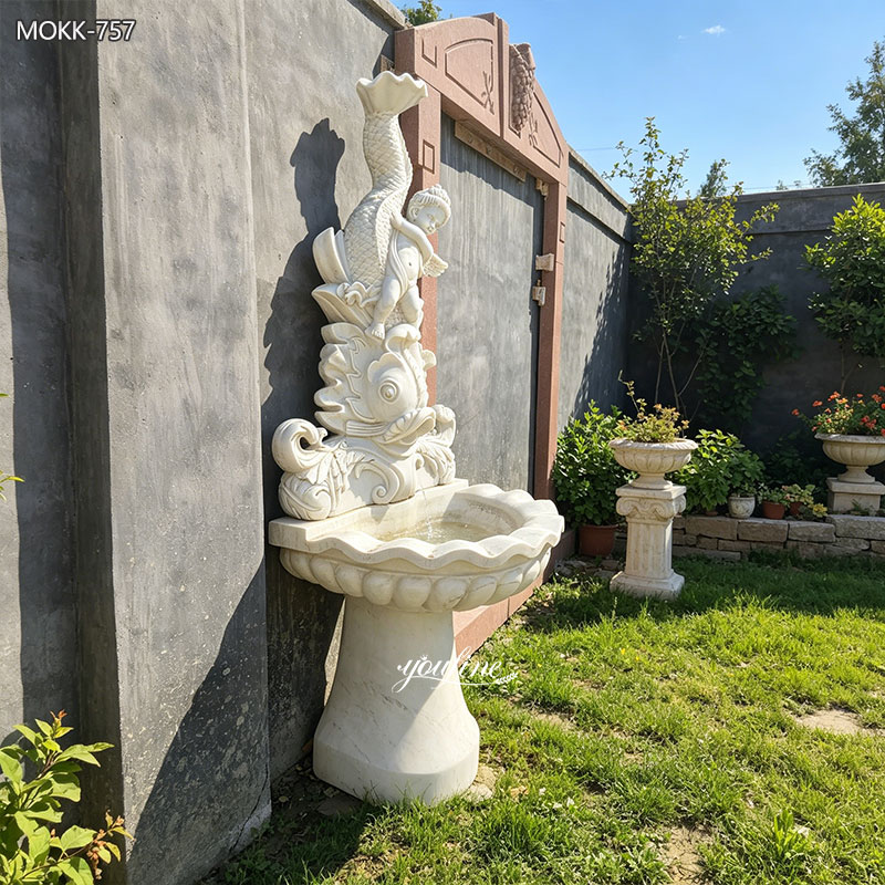 white fish wall fountain