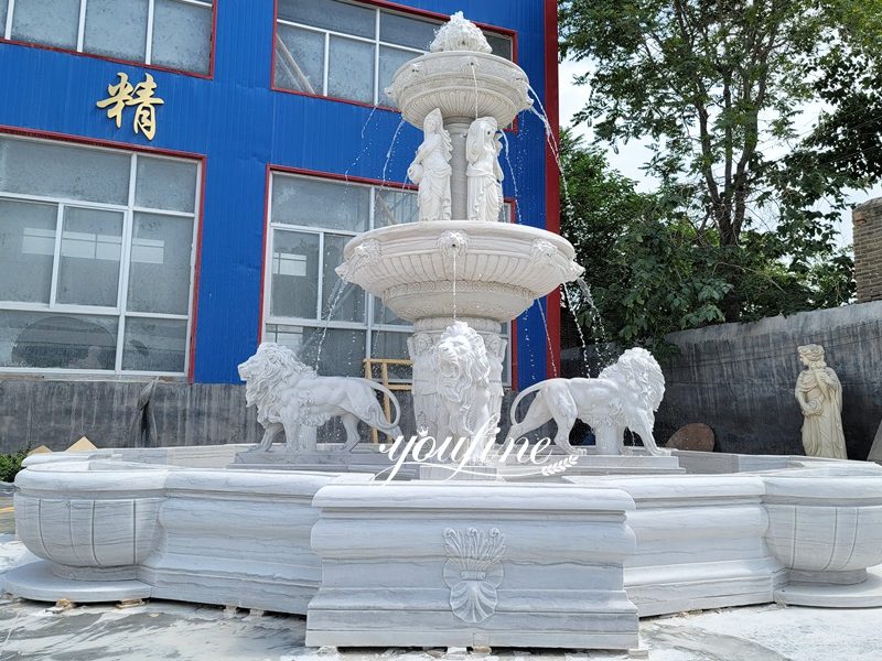 lion statue fountain with figure