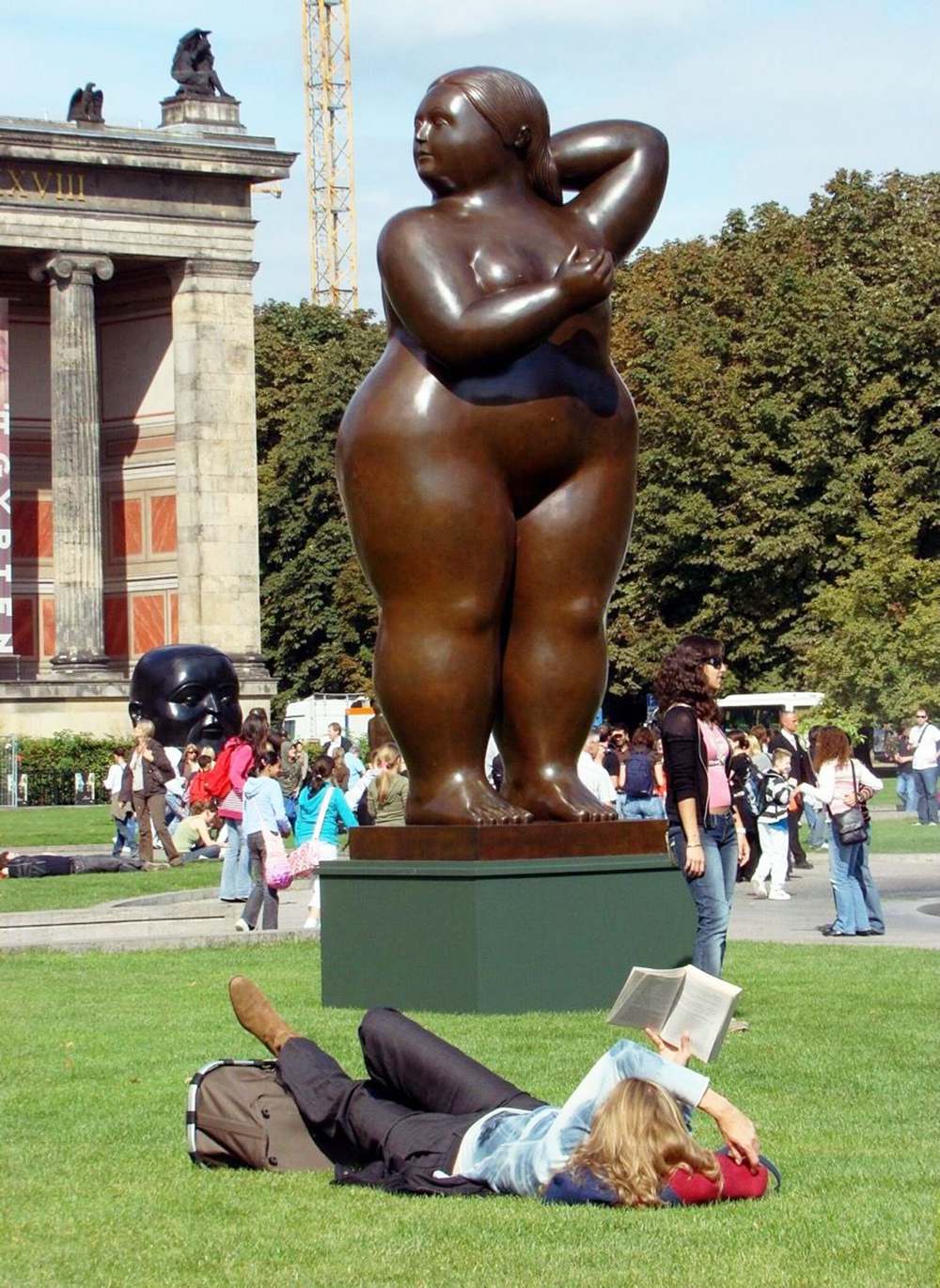 botero standing woman sculpture serene stillness paradox