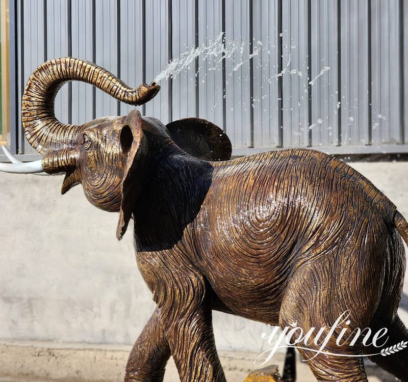 close up details of bronze elephant water fountain
