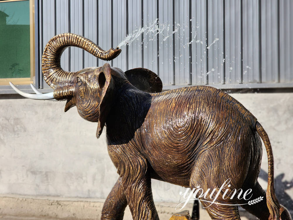 close up details of bronze elephant water fountain