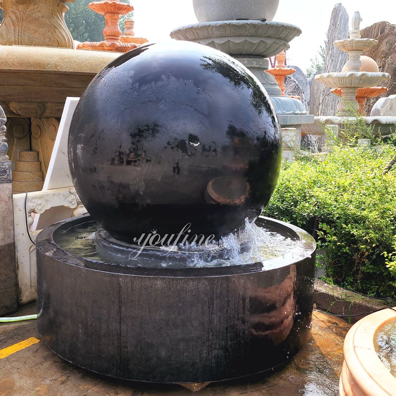 black rotating ball water fountain