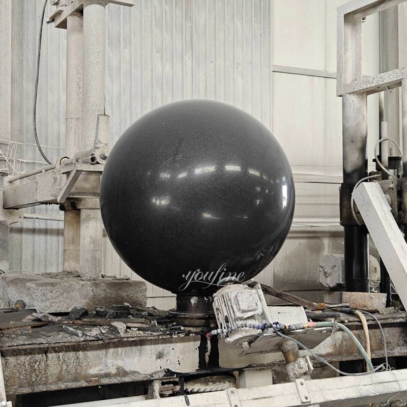 black water fountain with ball