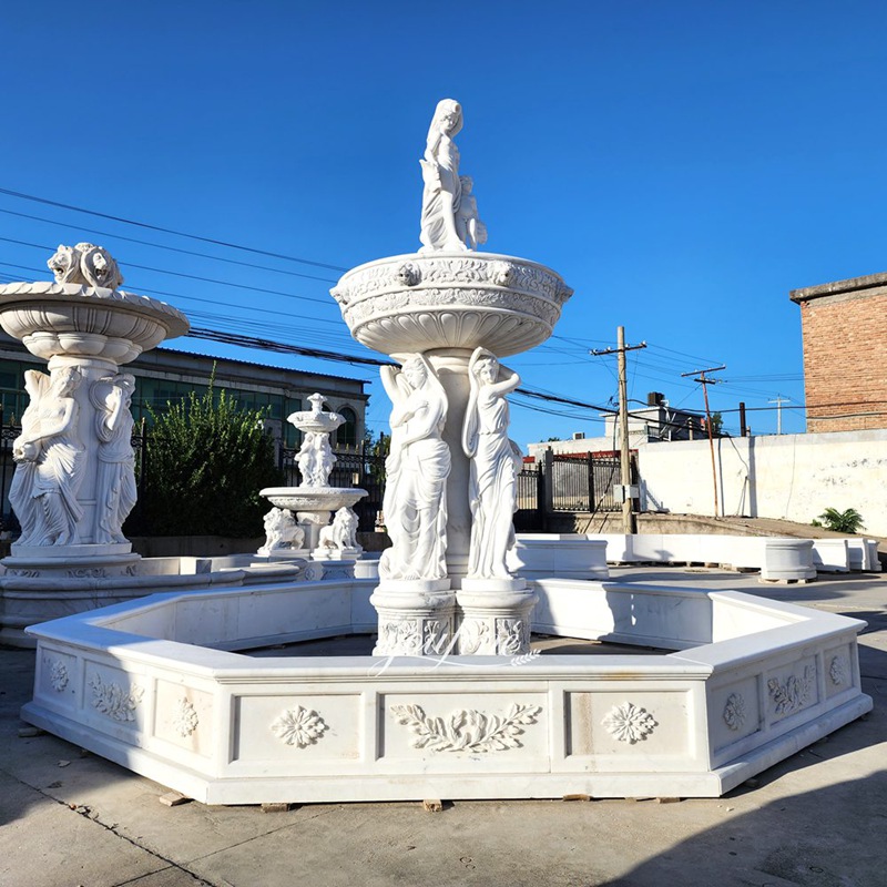 white marble woman with baby statue fountain