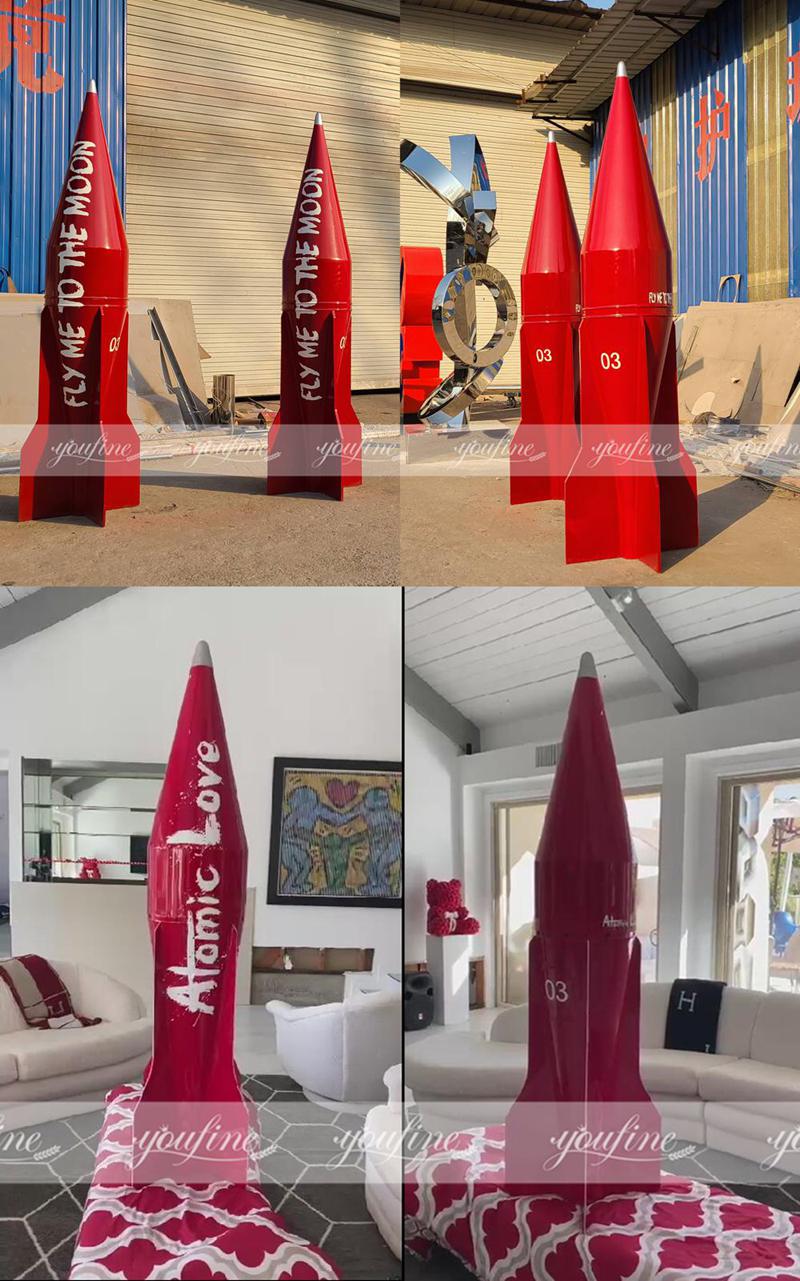 red metal rocket sculpture