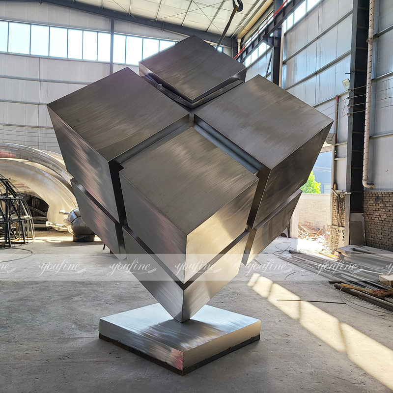 brushed stainless steel cube sculpture