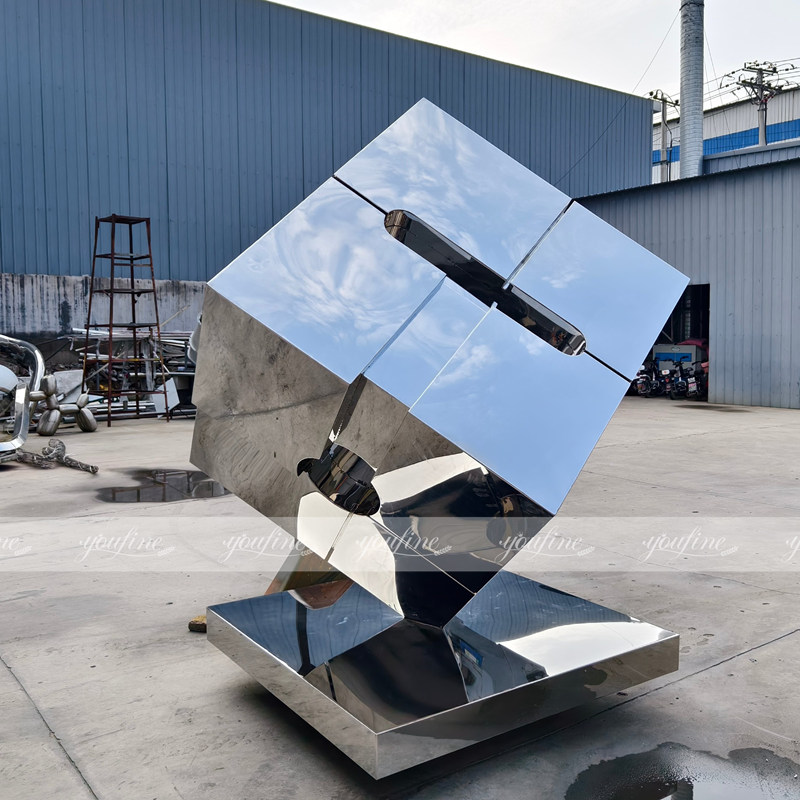 polished metal cube sculpture