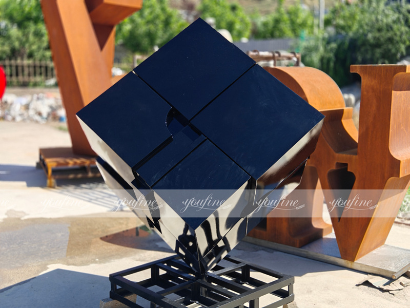 finished black cube sculpture