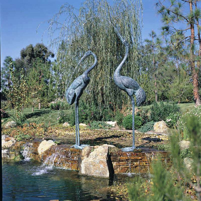 Bird water spout sculpture