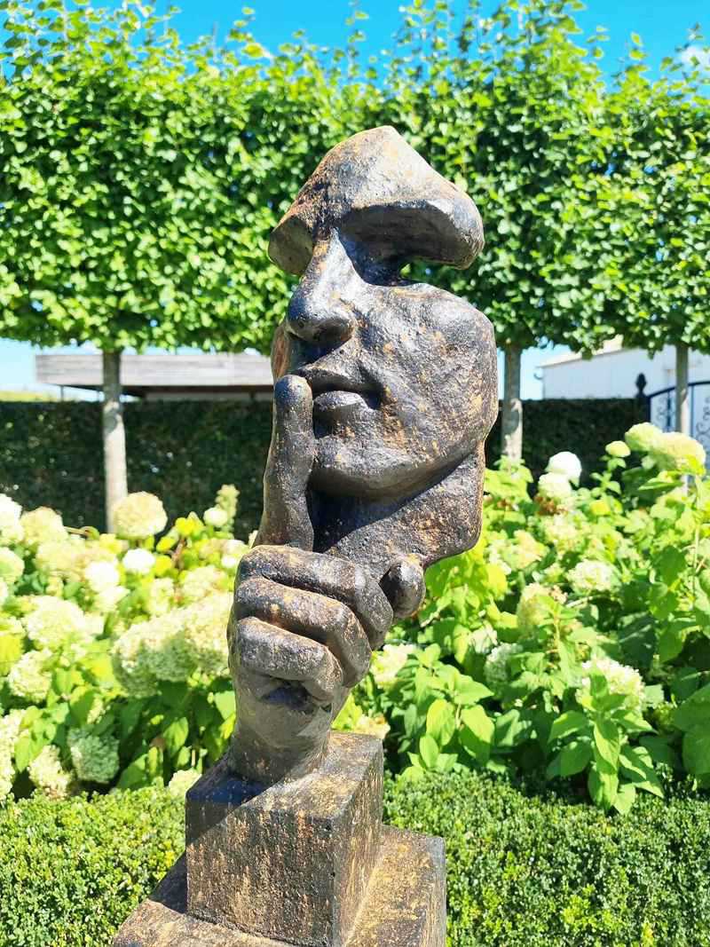 Creating depth with bronze face sculptures