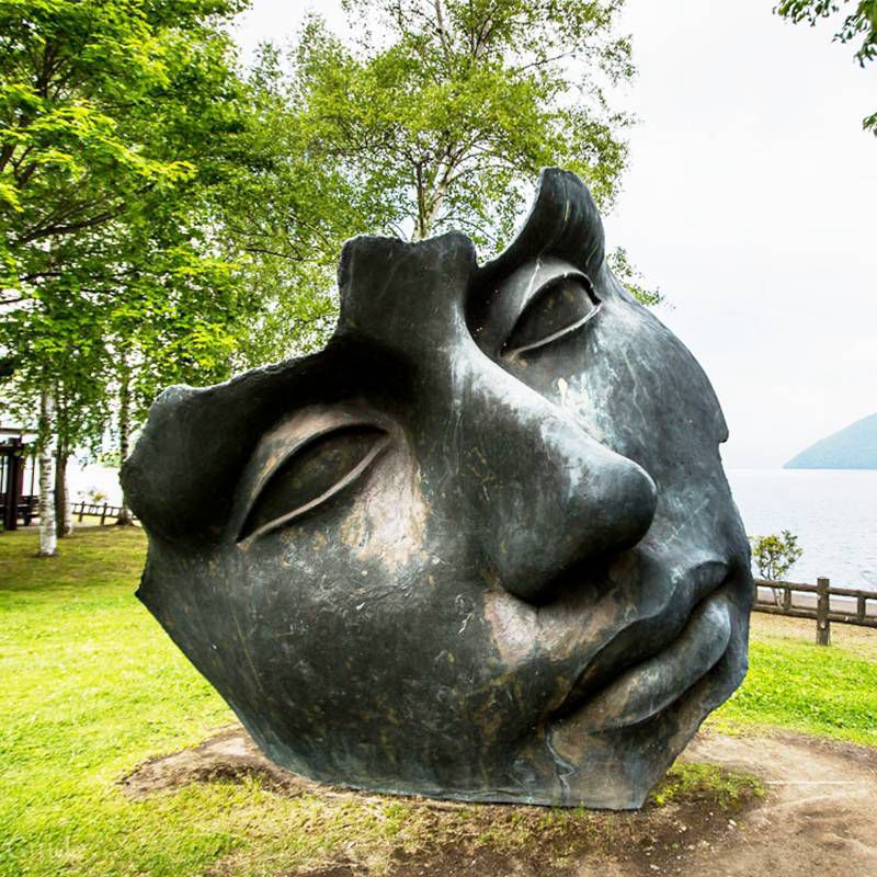 Expressive bronze facial artworks