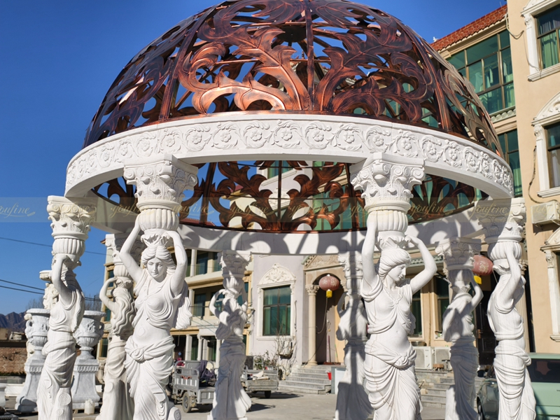 white marble gazebo with red iron top