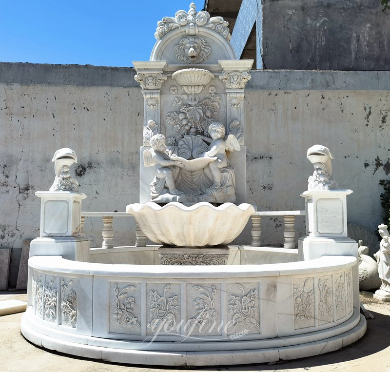 Angel and fish sculpture marble wall fountain