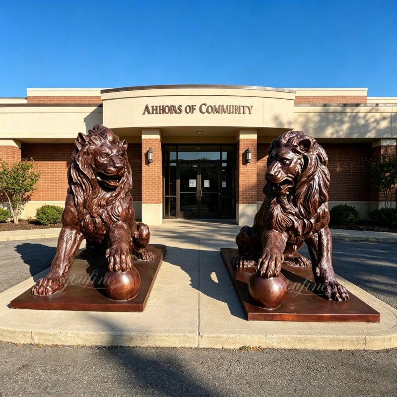 Brown Lion Statue with Ball