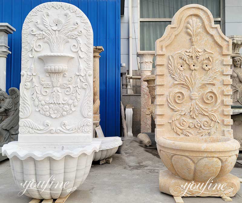 Simple carved marble wall fountain