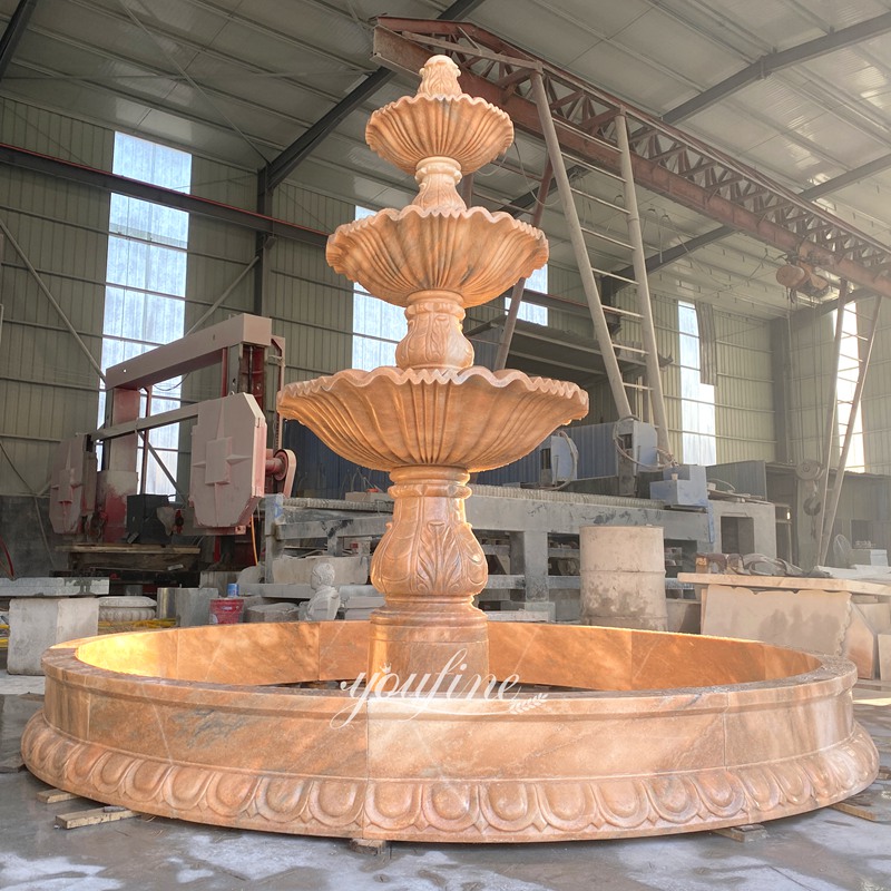 sunset red tiered water fountain outdoor