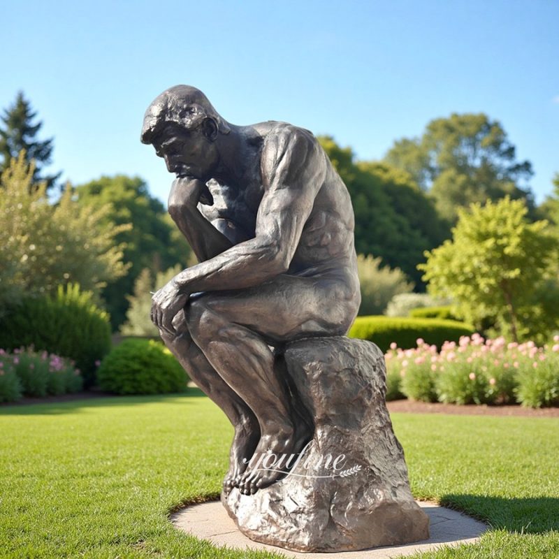 large thinking man bronze statue