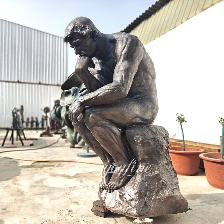 large thinking man statue