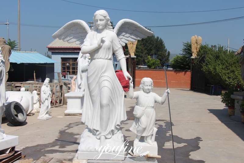 White marble angel statue with a little girl