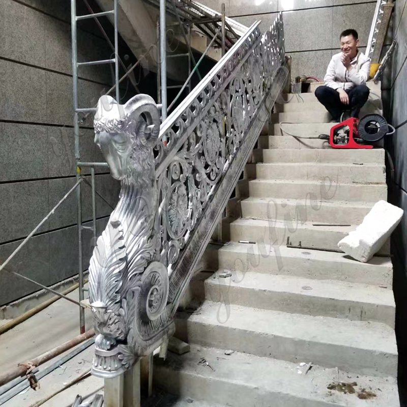 bronze rams head staircase railing