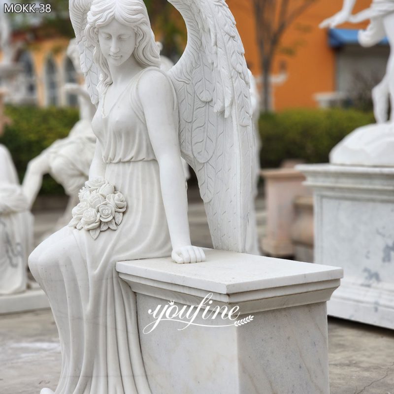 cemetery sitting angel statues headstone details