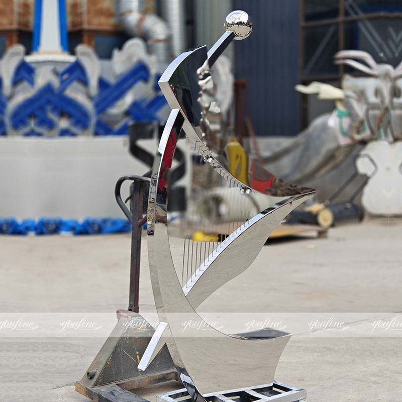 polished art harp sculpture