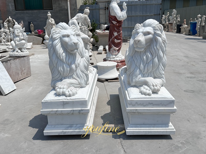 stone lions in front of house