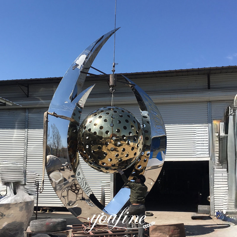 finished abstract sculpture with ball