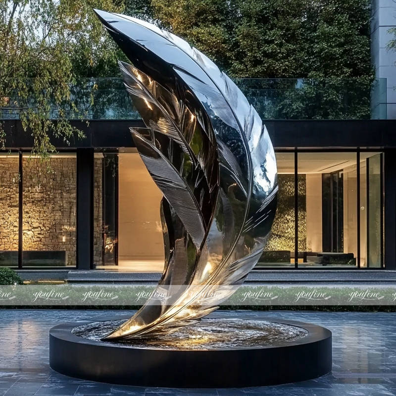 modern metal falling feathers sculpture