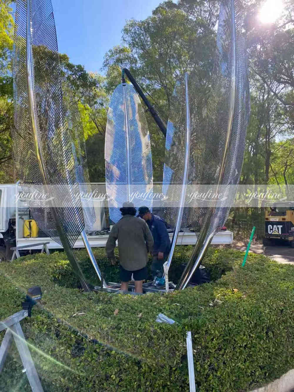 Australian customers installing the metal feature sculpture