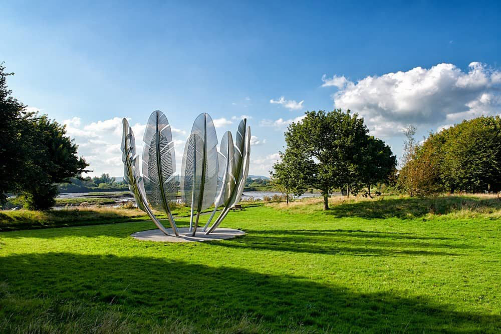 modern stainless steel metal feather sculpture