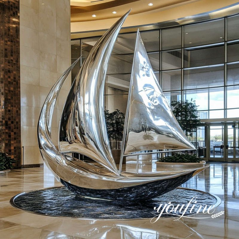 large stainless steel sailboat sculpture
