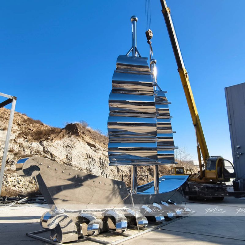 striking completed large stainless steel boat sculpture