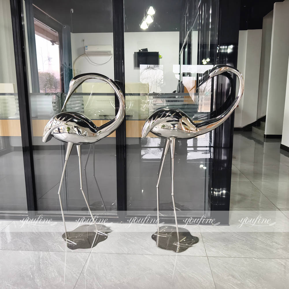 mirror polished life size heron sculpture