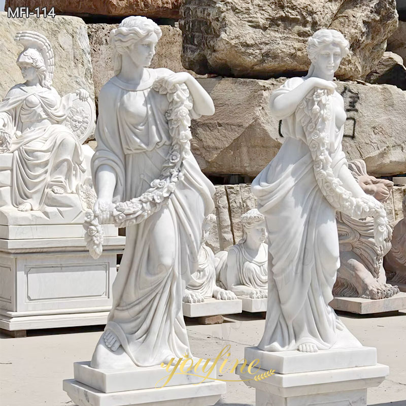 lifesize white marble female statue holding flower