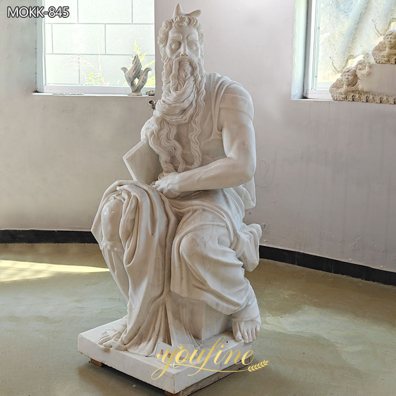 white marble statue of moses