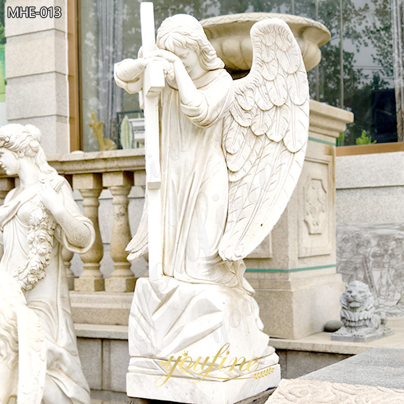 Marble gravestone angel with cross memorial