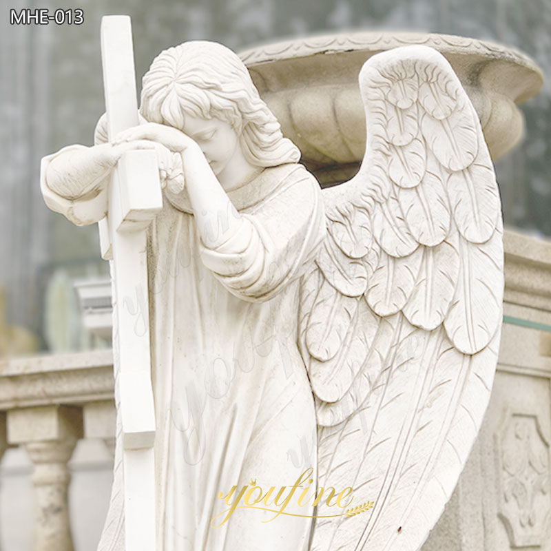 gravestone angel with cross statue
