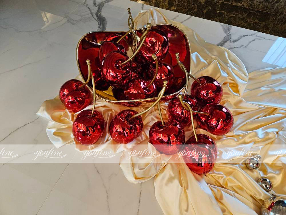 Feedback stainless steel cherry sculptures