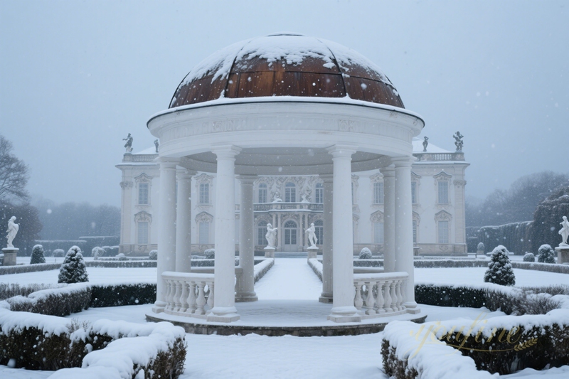 white large marble gazebo in snow day