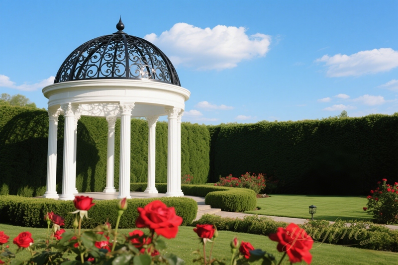 white marble gazebo with black iron top