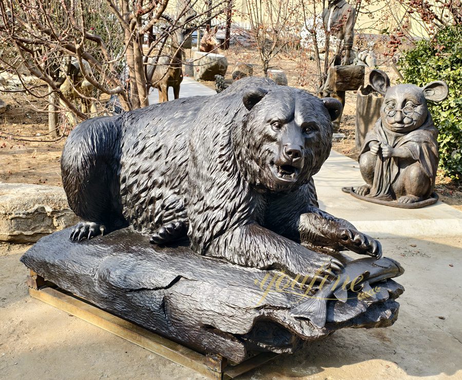 A bear eating fish sculpture