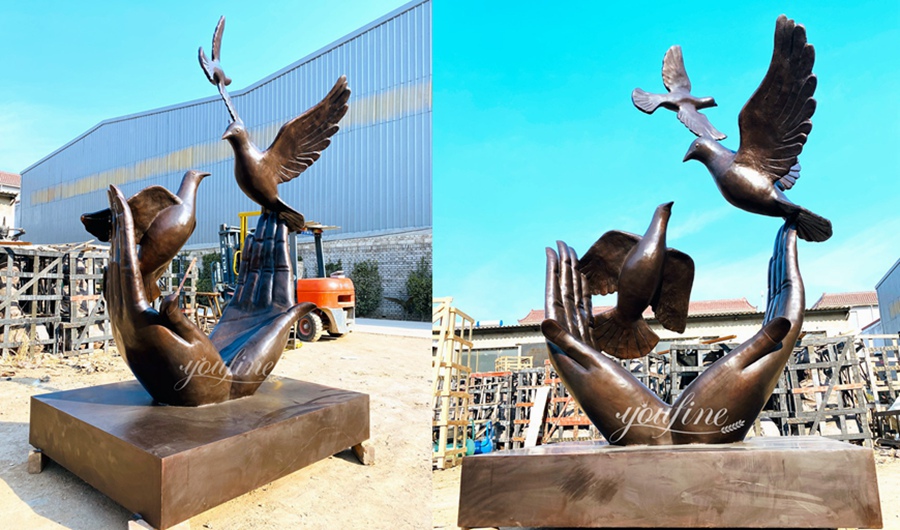 Peace dove and hand sculpture