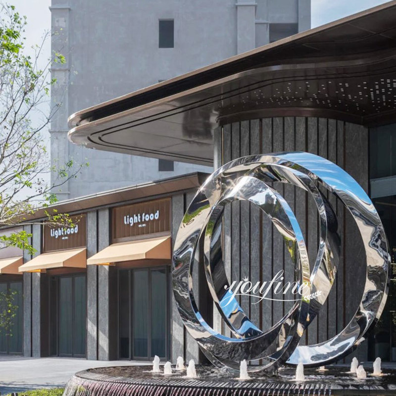 mirror polished abstract Möbius strip sculpture