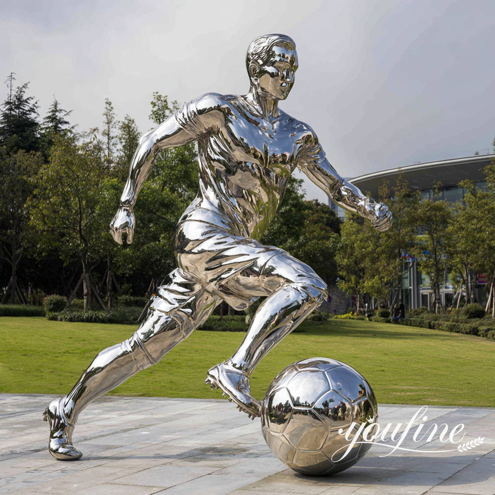 stainless steel soccer player sculpture