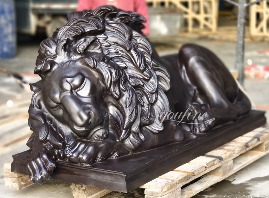 Large sleeping lion sculpture
