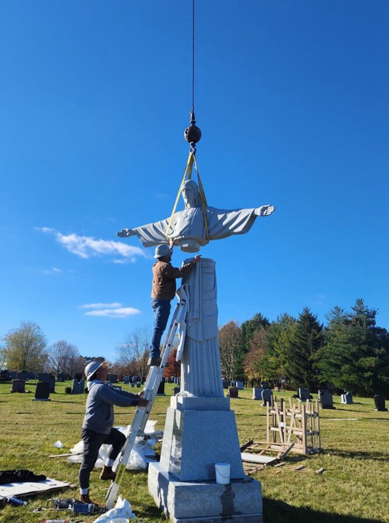 Installing-granite-holy-redeemer-statue