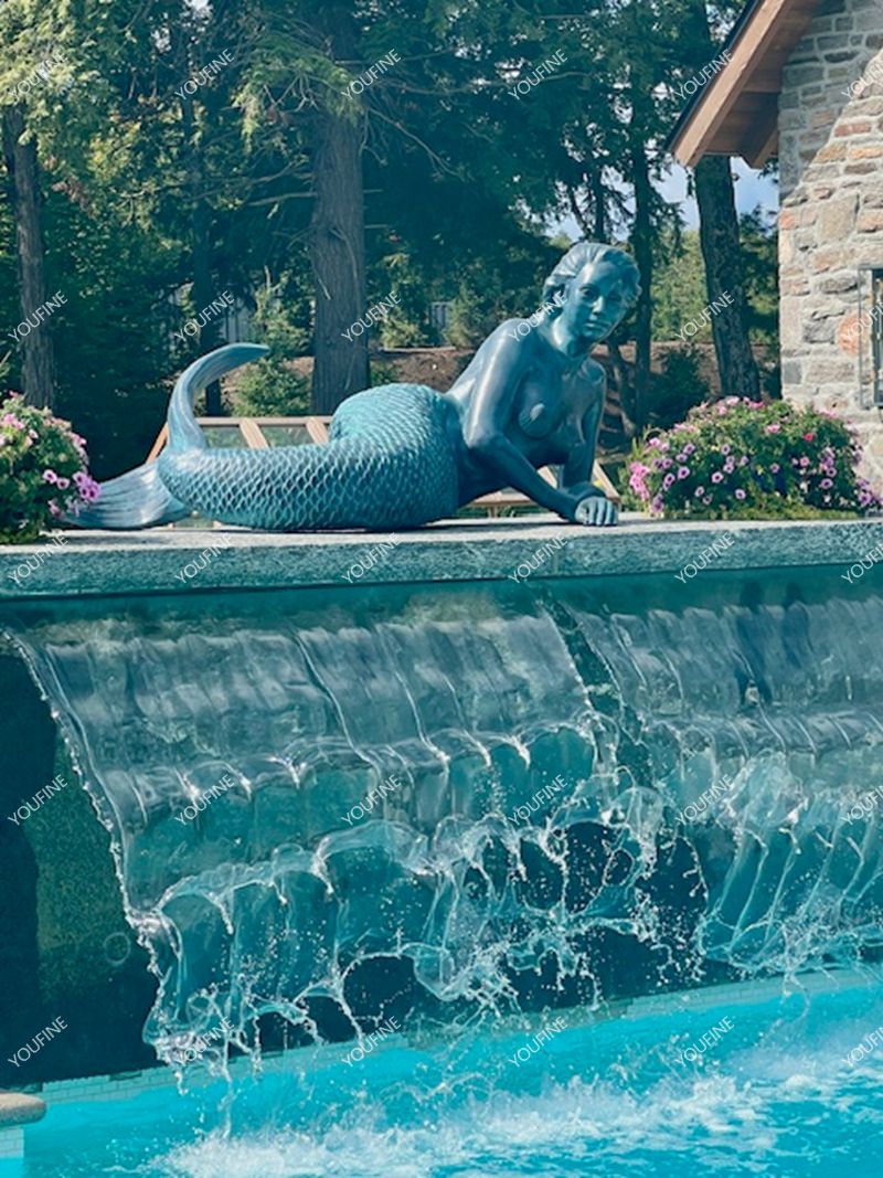 The Relaxed Mermaid on the Waterfall Edge