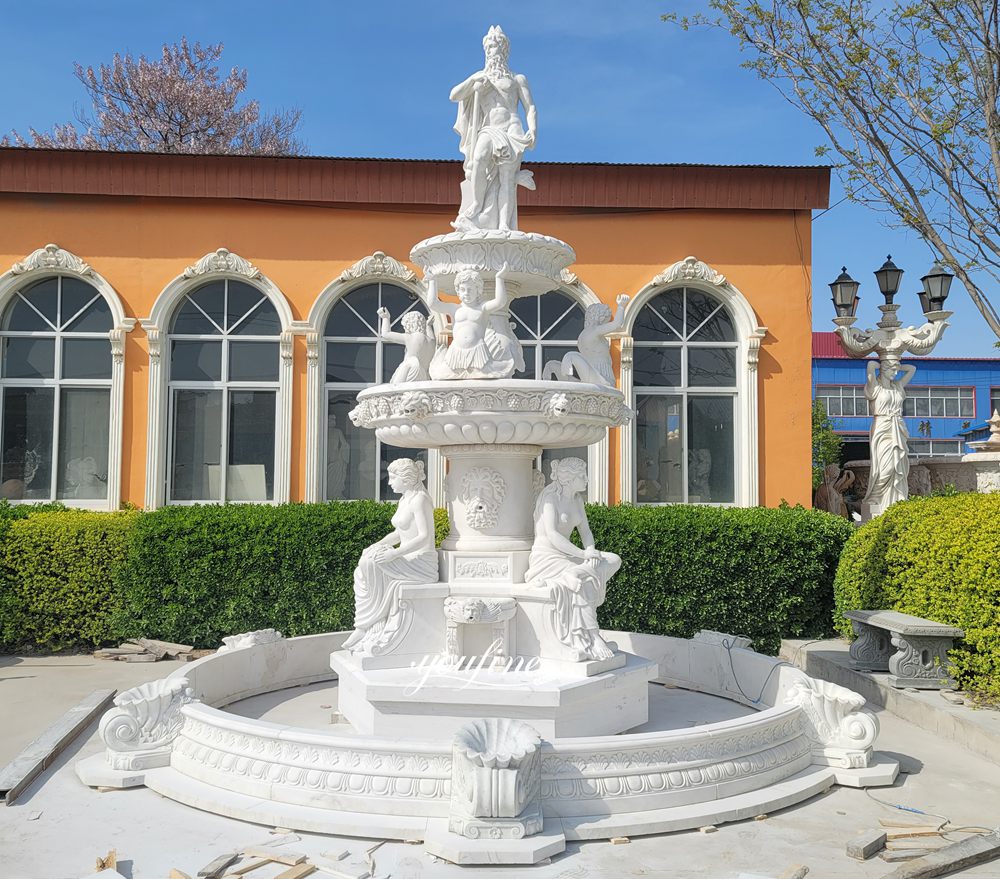 A fountain featuring a standing sea god and a seated woman