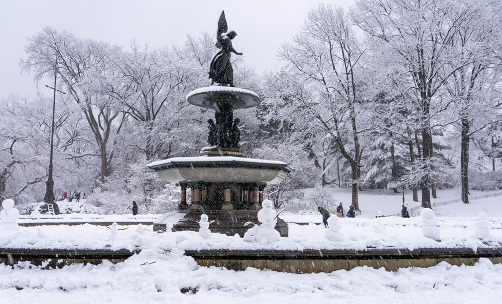 outdoor marble fountain in snow